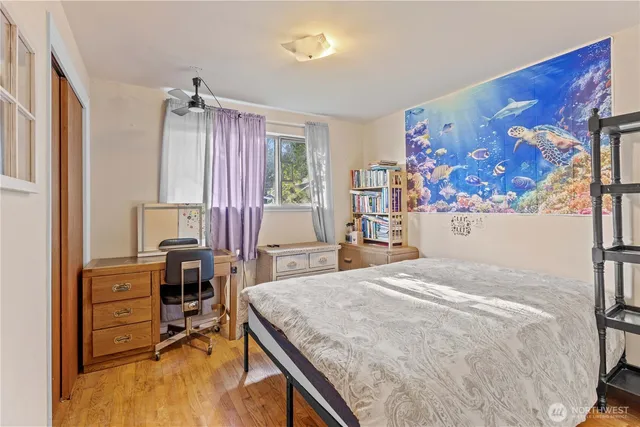 a bedroom with a bed and furniture