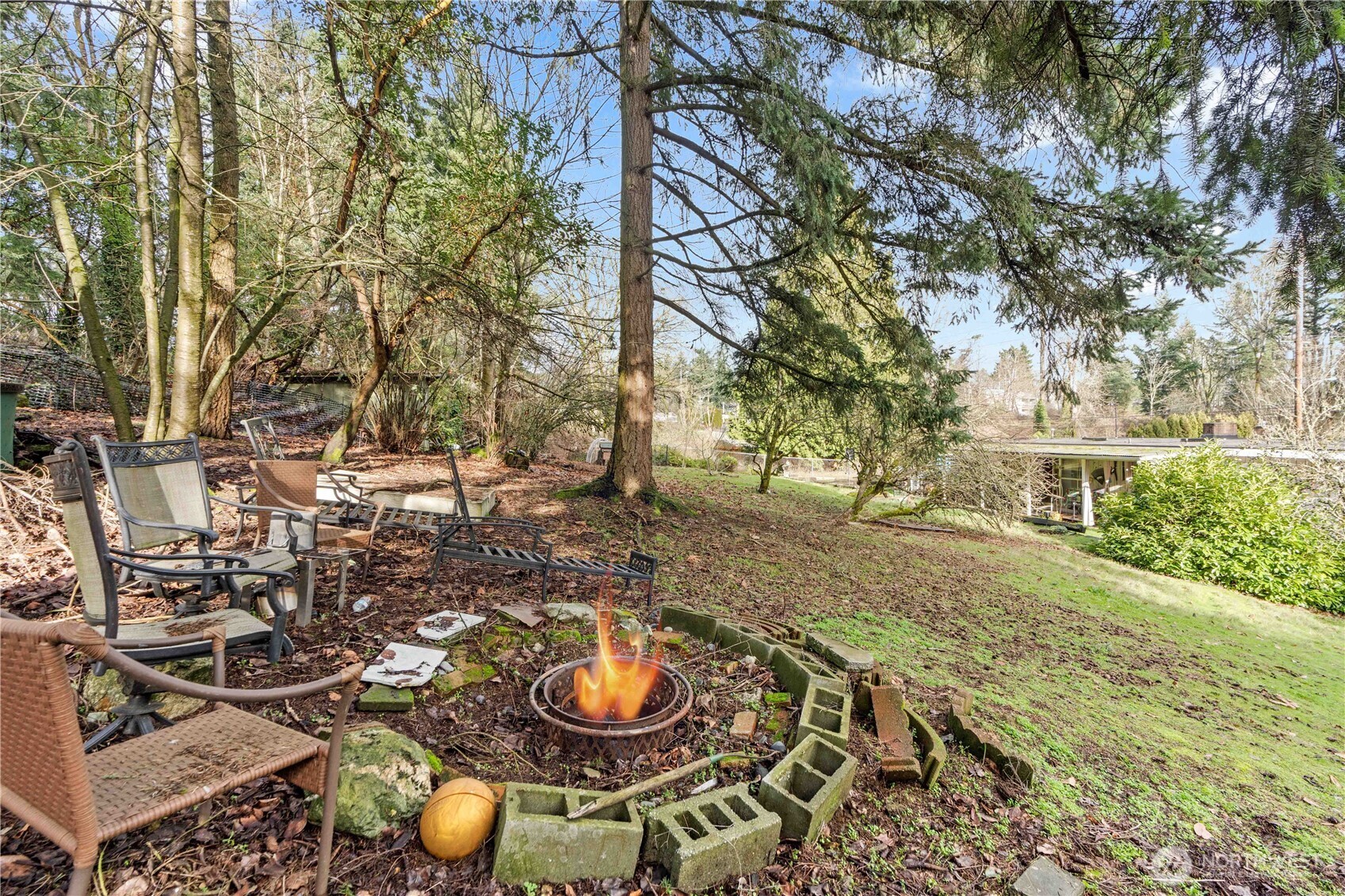 22415 Military Road South SeaTac, WA 98198 - Photo 22 of 31 a view of a backyard with table and chairs with wooden fence and plants