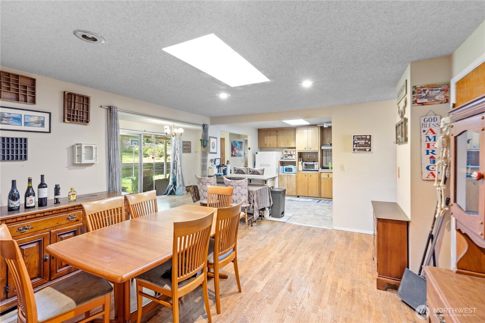 22415 Military Road South SeaTac, WA 98198 - Photo 3 of 31 a view of a dining room with furniture window and wooden floor