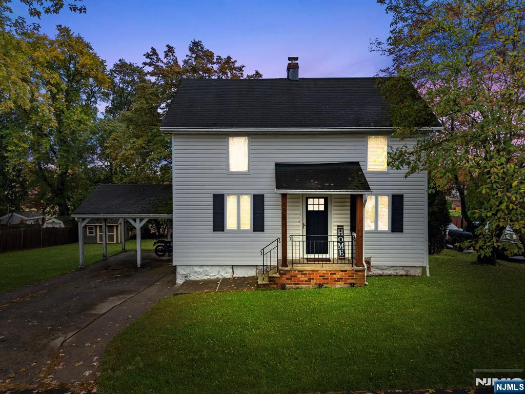 a front view of a house with a yard