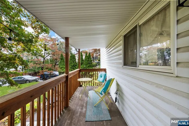 a view of a two chairs in the balcony