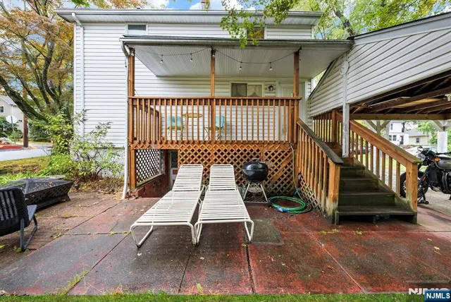 a view of a patio with a table and chairs