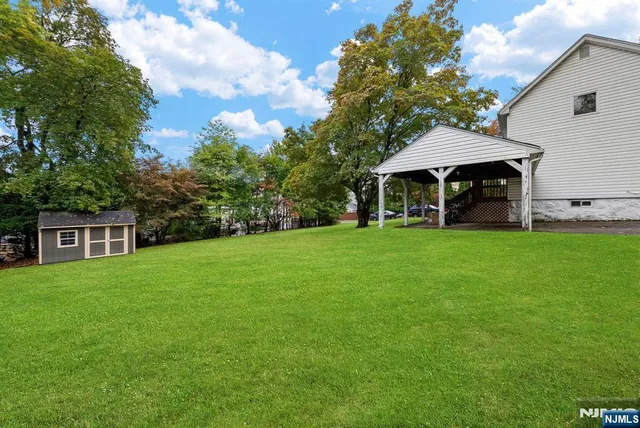 a view of a house with a yard porch and sitting area