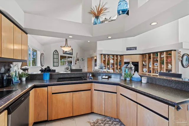 a kitchen with lots of counter top space and a sink