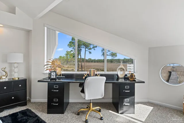 a work room with furniture and a window