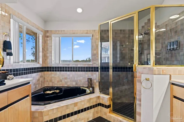 a bathroom with a tub and a sink