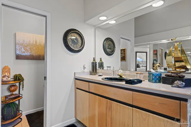 a kitchen with a sink and a stove top oven