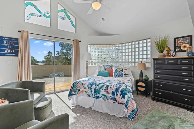 a bedroom with a bed and a couch