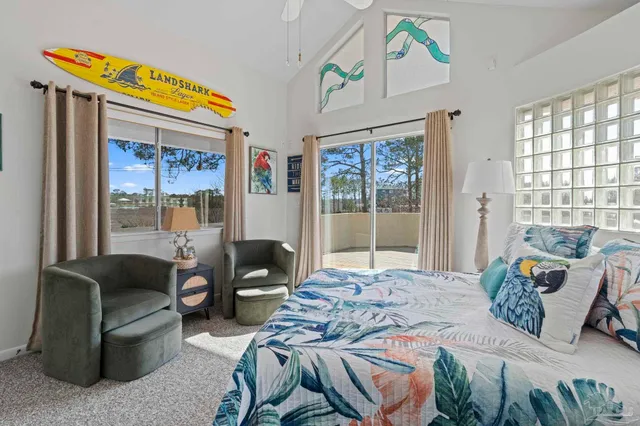 a bedroom with furniture and a window