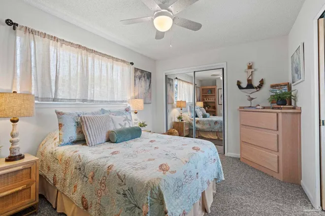 a bedroom with a bed and a cabinets