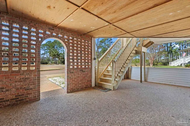 a view of an empty room with stairs