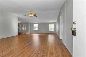 23596 Goode Road Cleveland, TX 77328 - Photo 14 of 14 a view of empty room with wooden floor and fan