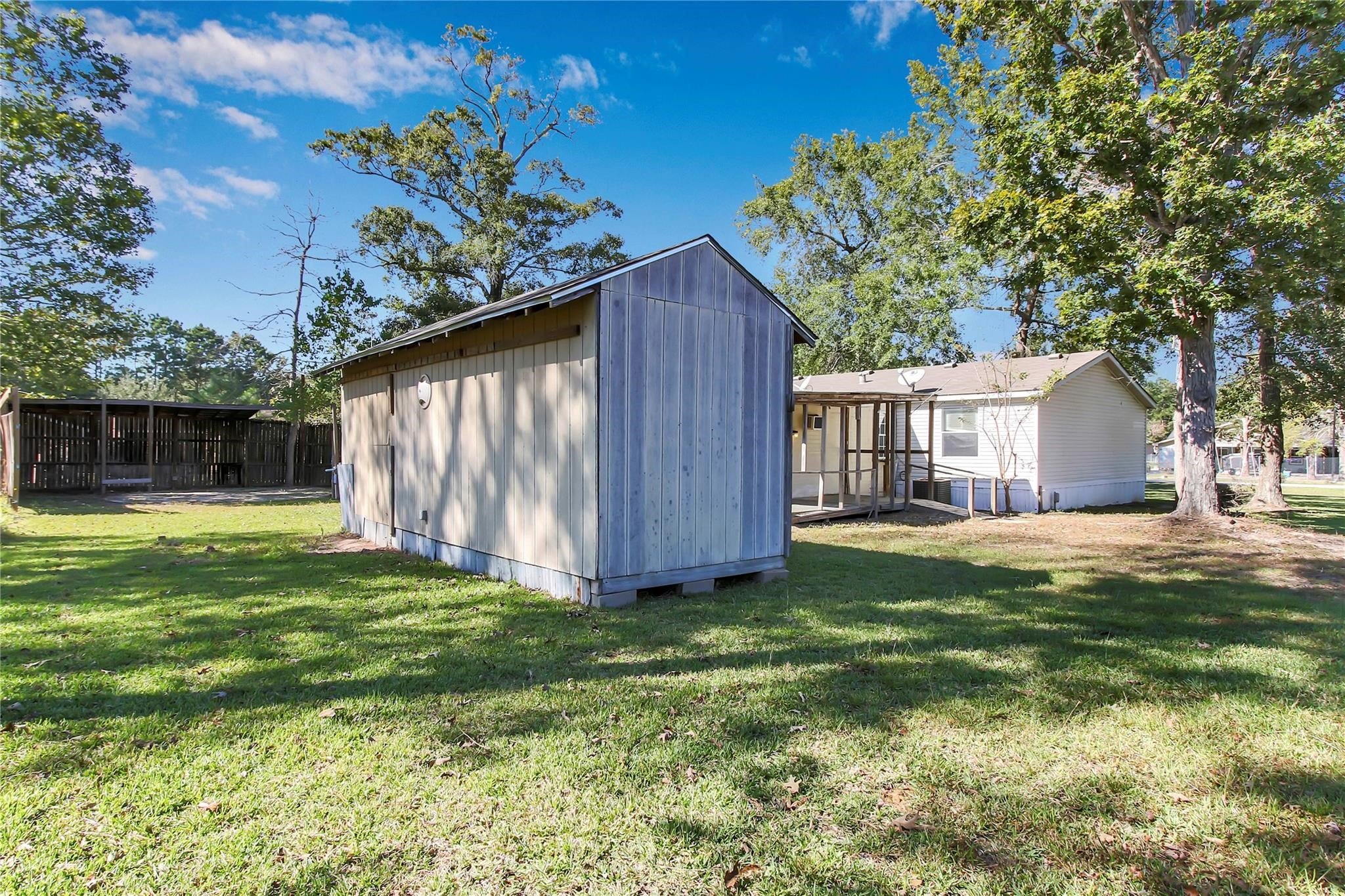 23596 Goode Road Cleveland, TX 77328 - Photo 4 of 14 a house view with a garden space