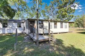 a house with trees in the background