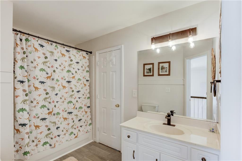 2310 Olde Hickory Place Monroe, GA 30656 - Photo 28 of 46 a bathroom with a sink and a mirror