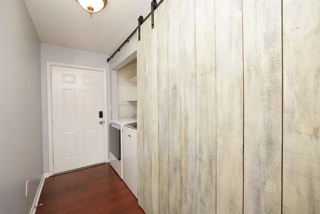a bathroom with a sink and glass door