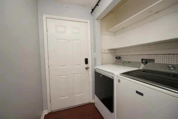 a view of a utility room with washer and dryer