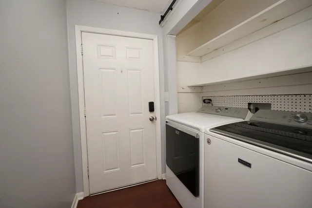 a view of a utility room with washer and dryer