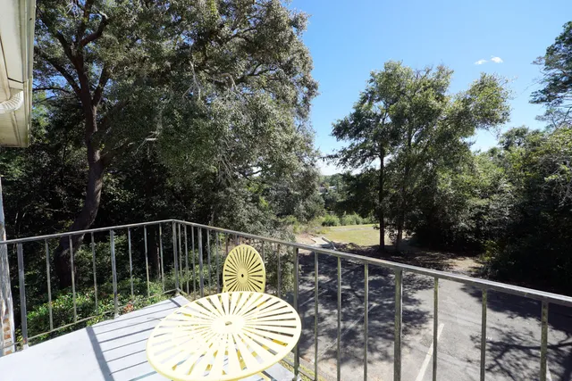 a view of balcony with furniture