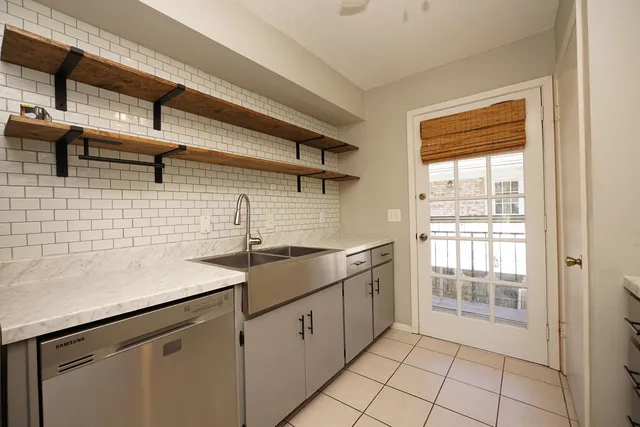 a kitchen with a sink and cabinets