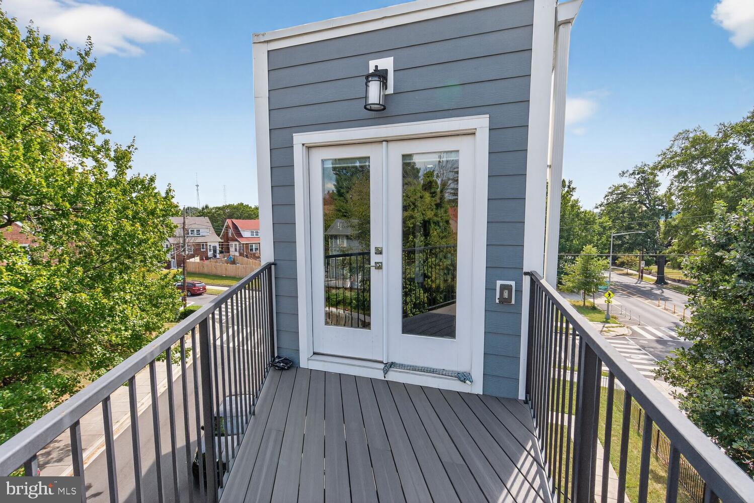 5700 Blair Road Northeast Washington, DC 20011 - Photo 19 of 47 a balcony with wooden floor and wooden fence