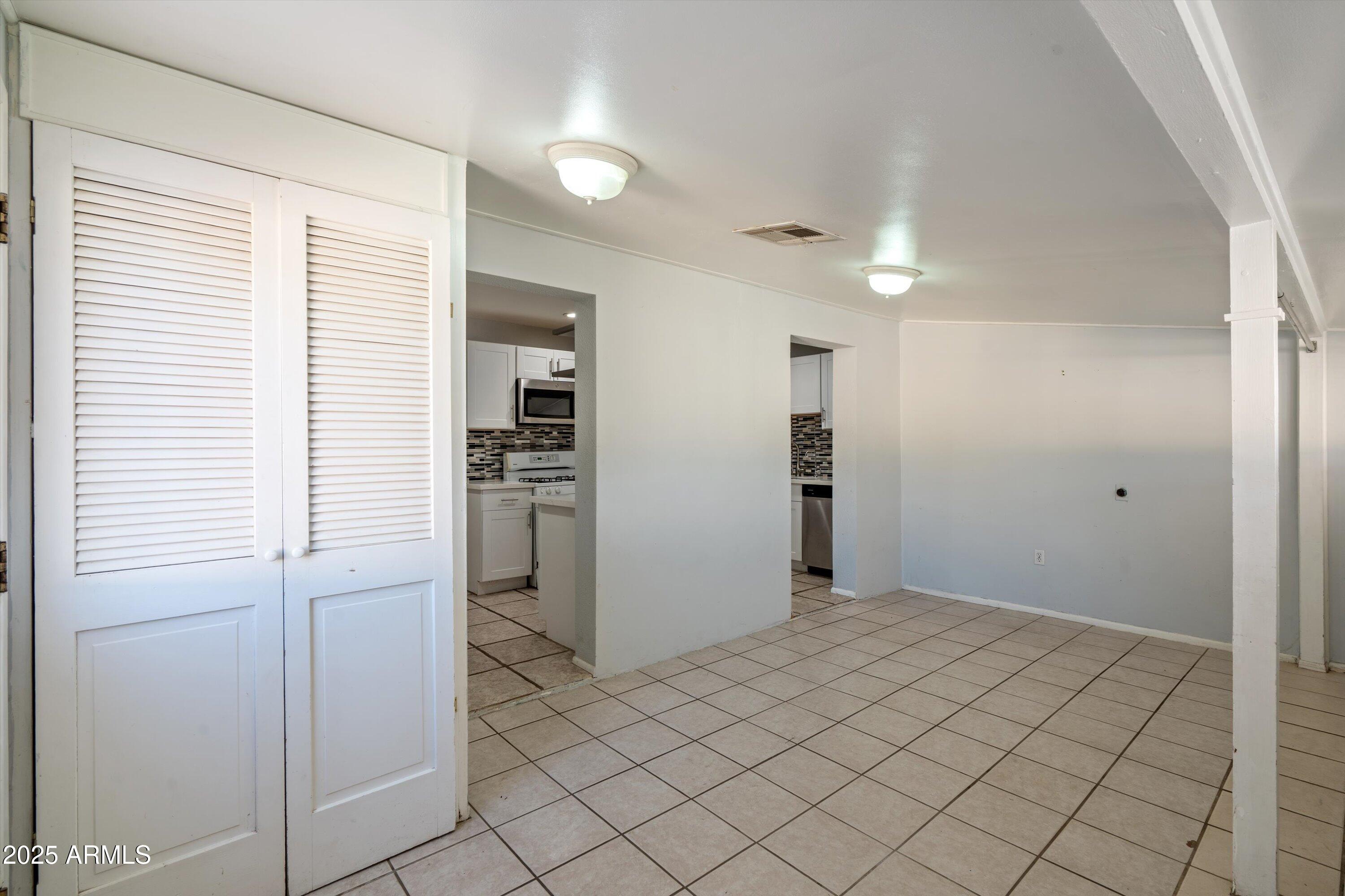 8216 North 9th Street Phoenix, AZ 85020 - Photo 12 of 38 a view of a kitchen cabinets and stainless steel appliances