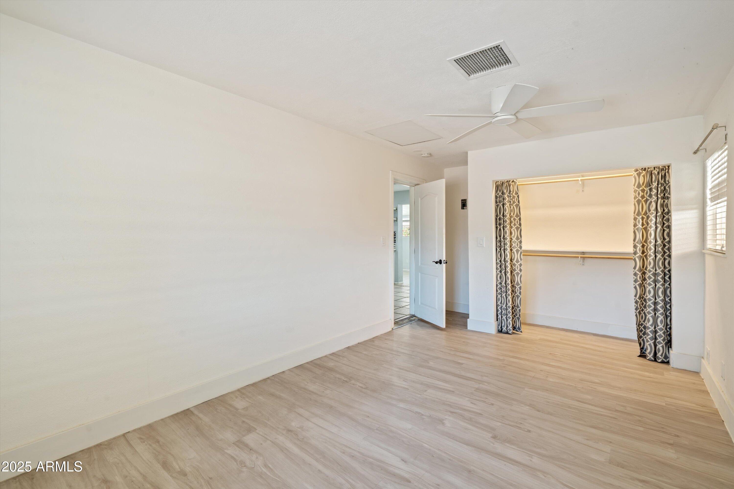 8216 North 9th Street Phoenix, AZ 85020 - Photo 14 of 38 a view of an empty room with wooden floor