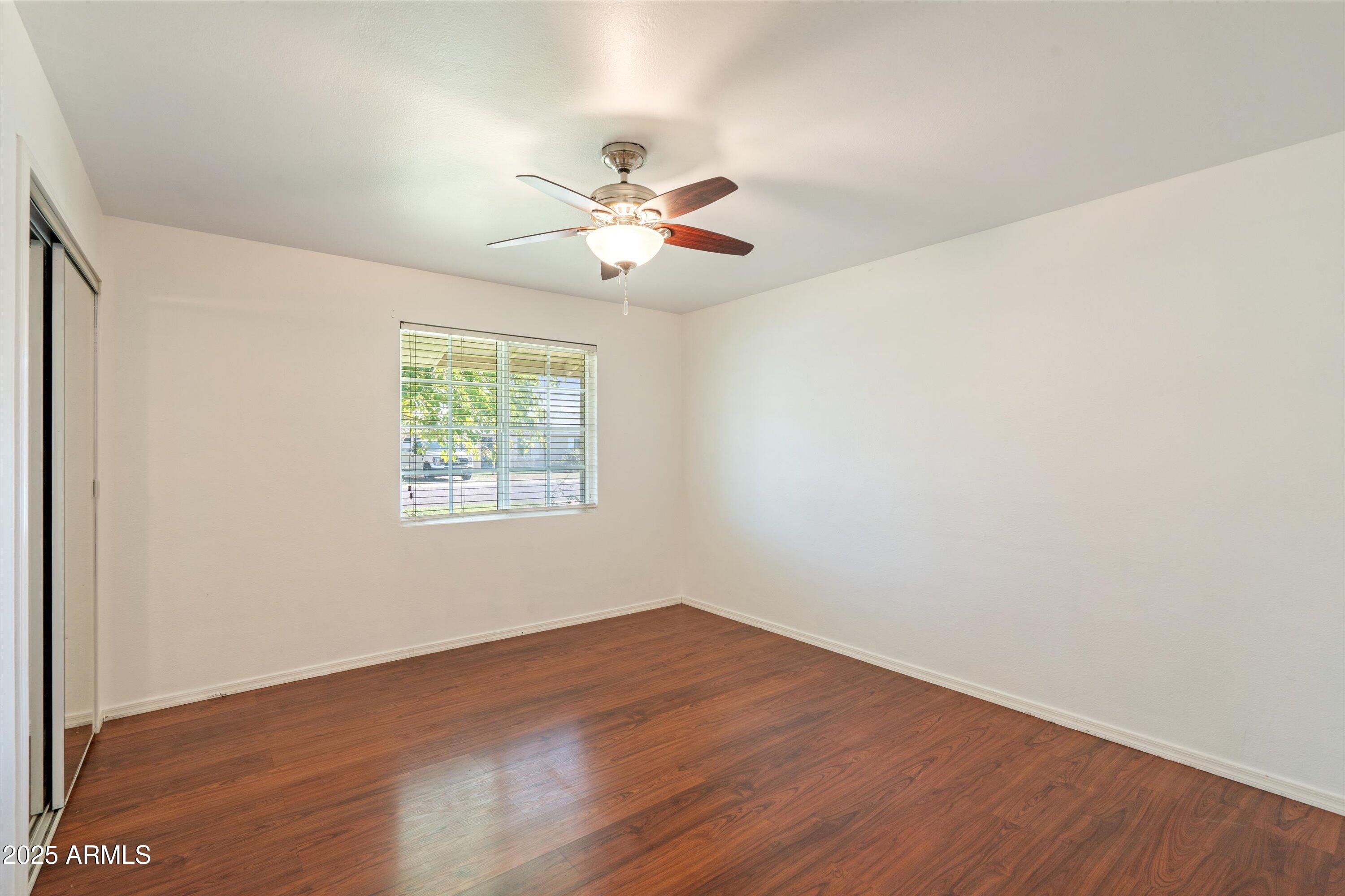 8216 North 9th Street Phoenix, AZ 85020 - Photo 17 of 38 wooden floor in an empty room with a window