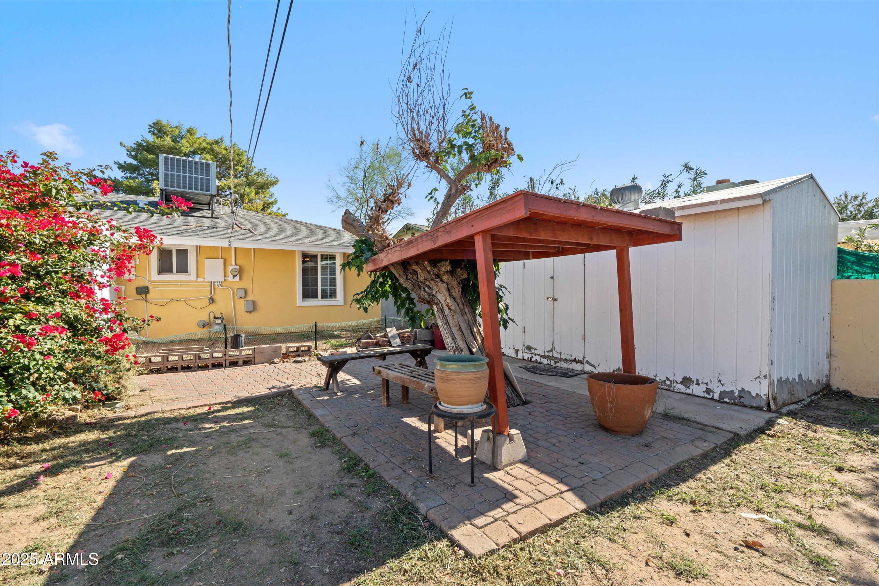 8216 North 9th Street Phoenix, AZ 85020 - Photo 27 of 38 a view of a backyard with sitting area and furniture