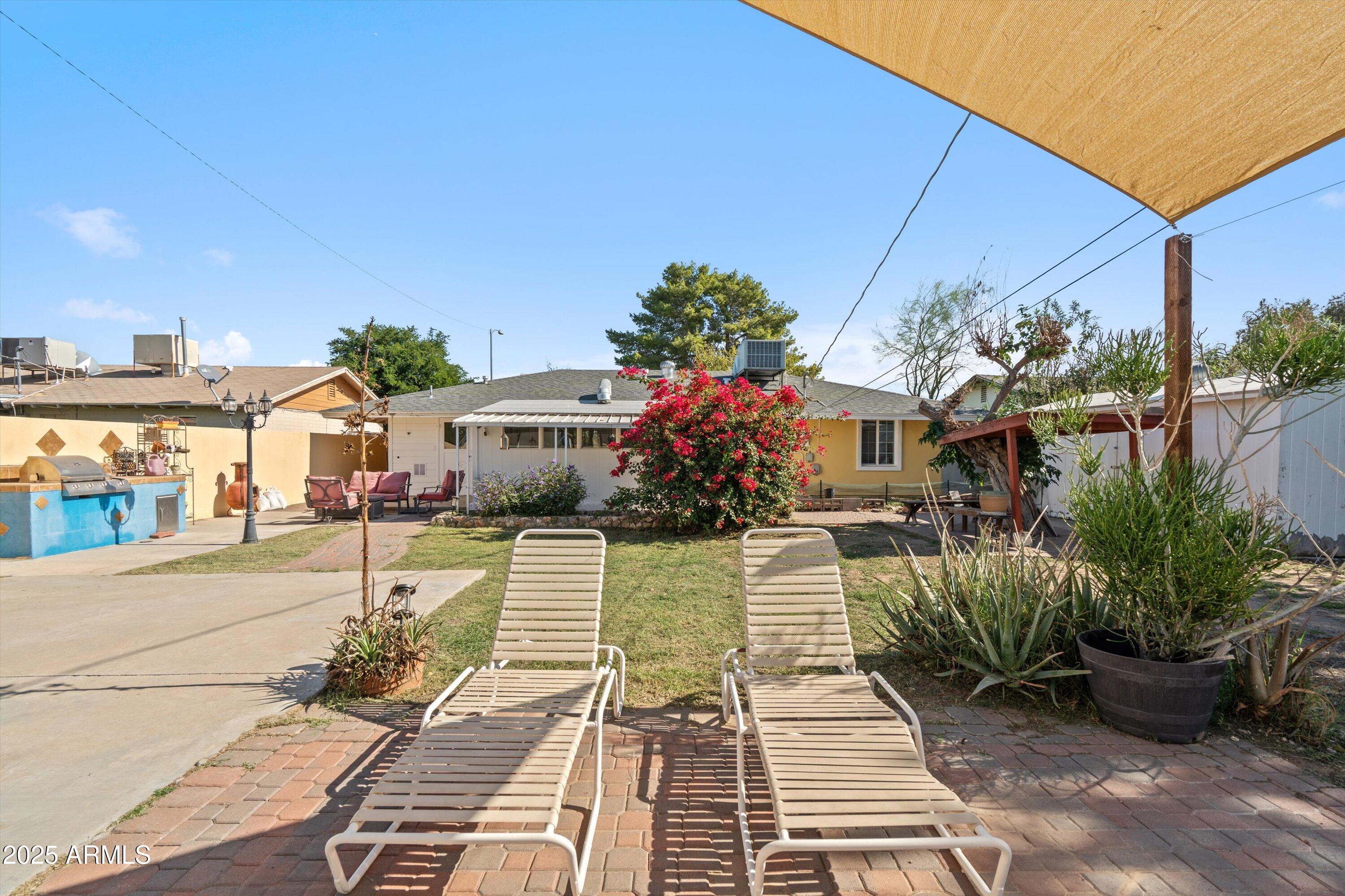 8216 North 9th Street Phoenix, AZ 85020 - Photo 28 of 38 a view of a patio with couches table and chairs and potted plants