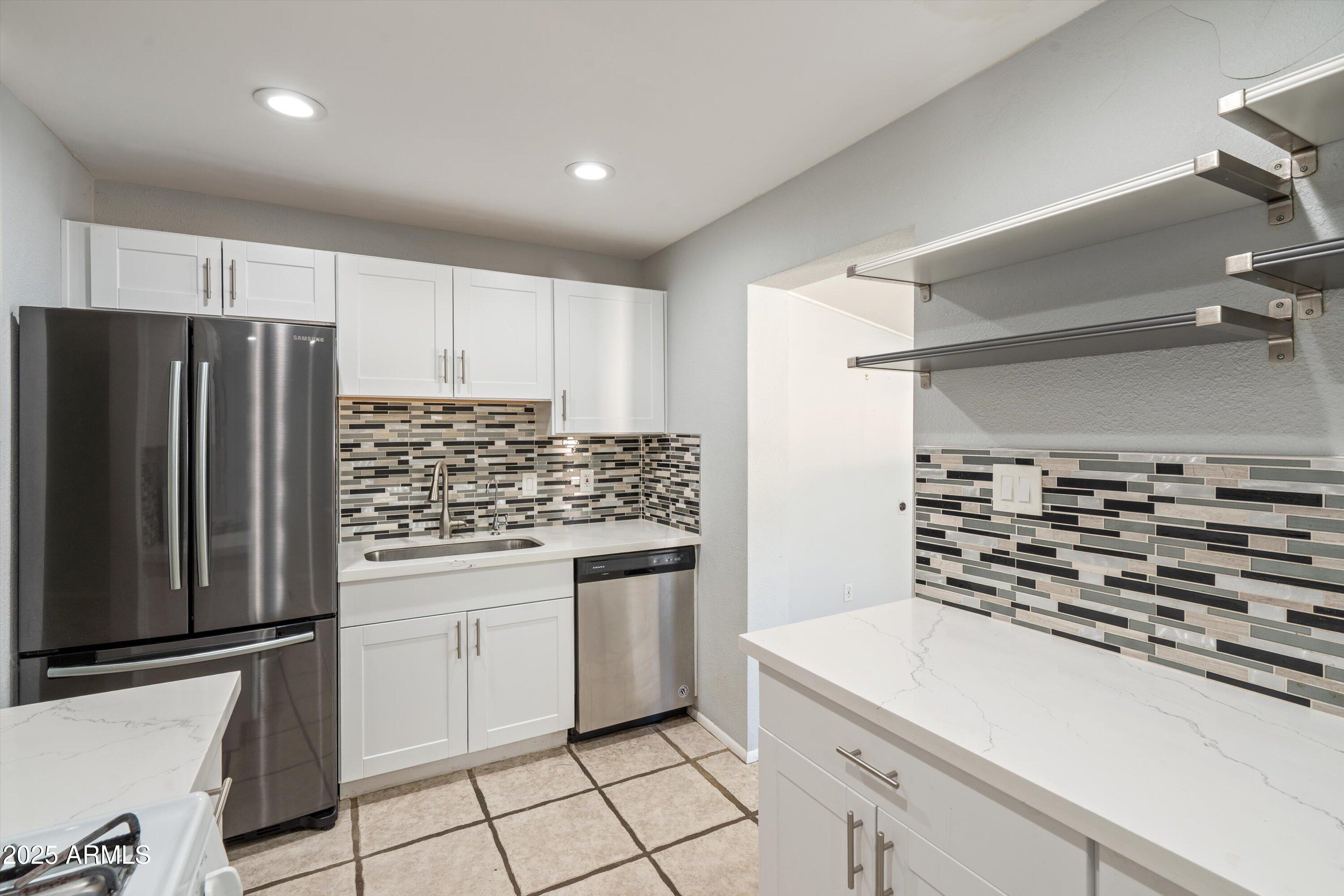 8216 North 9th Street Phoenix, AZ 85020 - Photo 10 of 38 a kitchen with a stove and a refrigerator