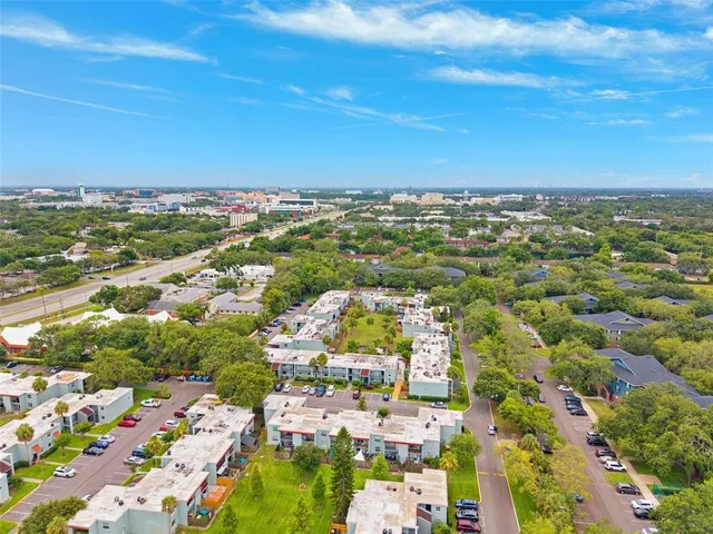an aerial view of residential building and ocean