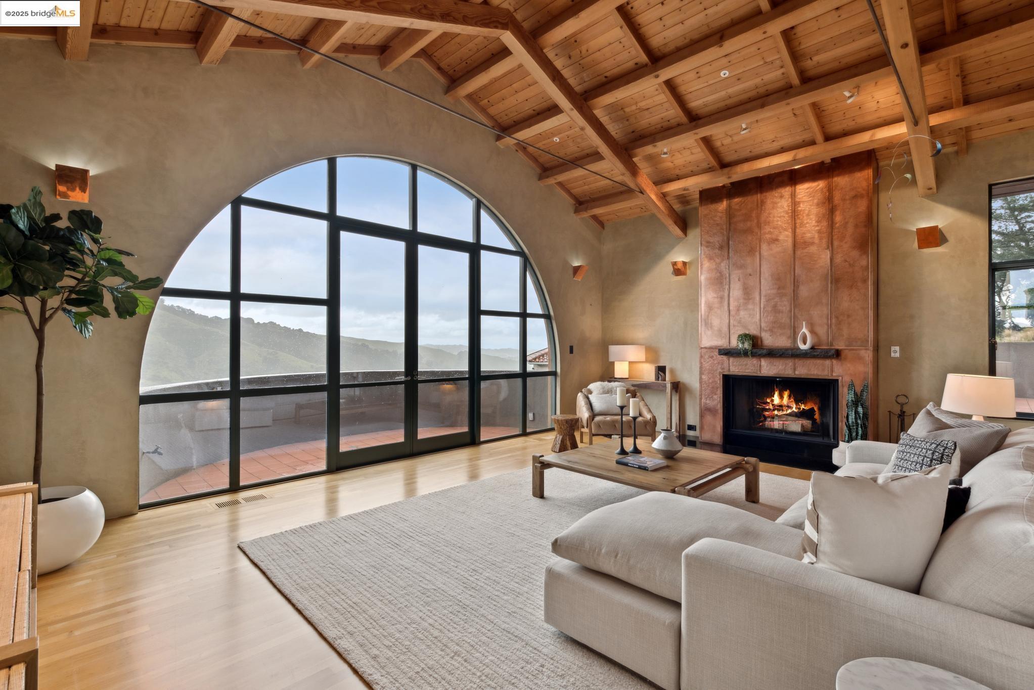 5 Woodside Way Oakland, CA 94611 - Photo 12 of 59 a living room with furniture and a fireplace