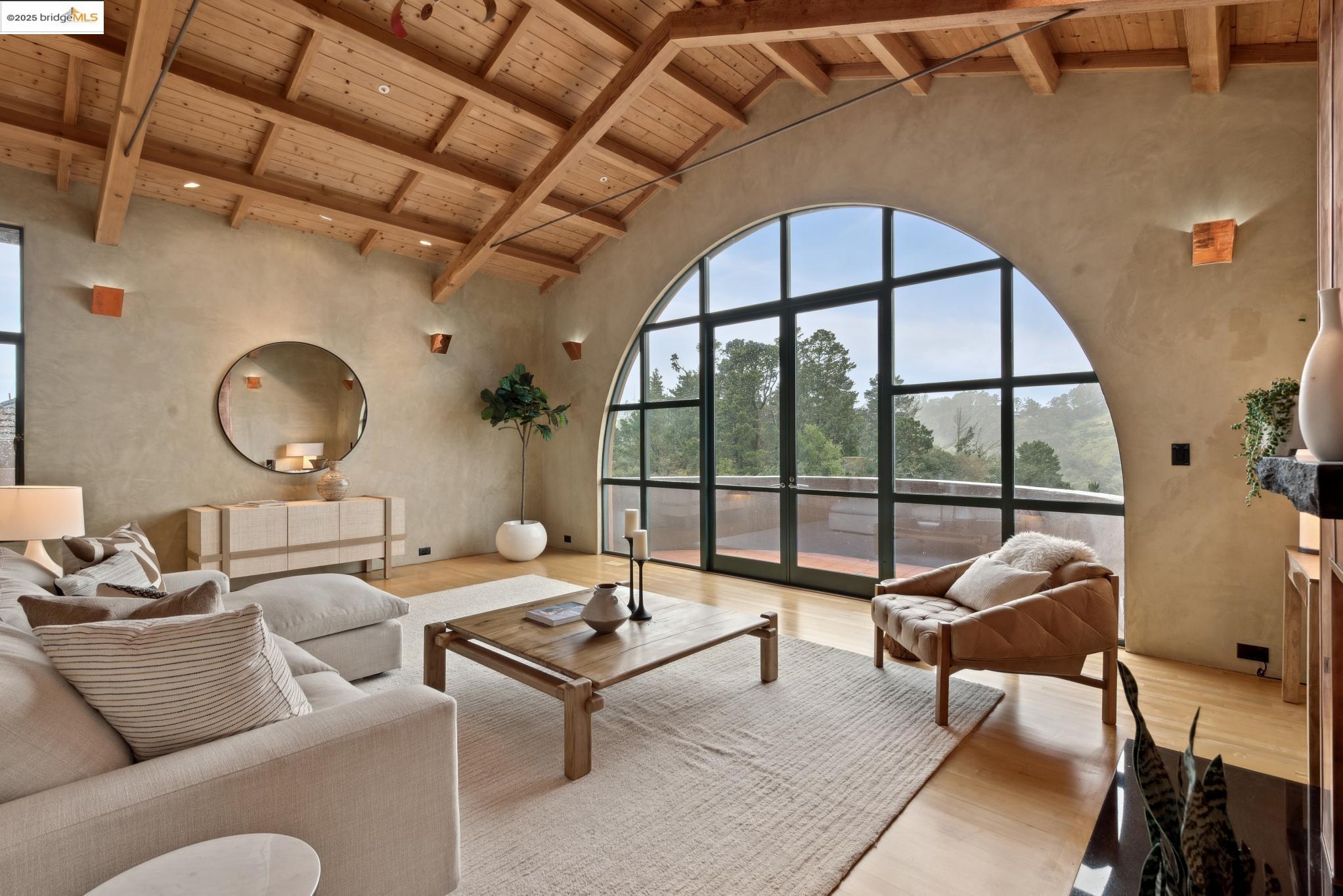 5 Woodside Way Oakland, CA 94611 - Photo 13 of 59 a living room with furniture and a large window