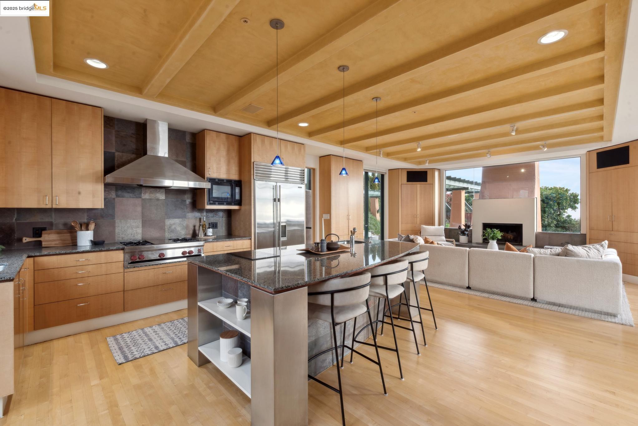 5 Woodside Way Oakland, CA 94611 - Photo 18 of 59 a kitchen with stainless steel appliances granite countertop a stove and cabinets