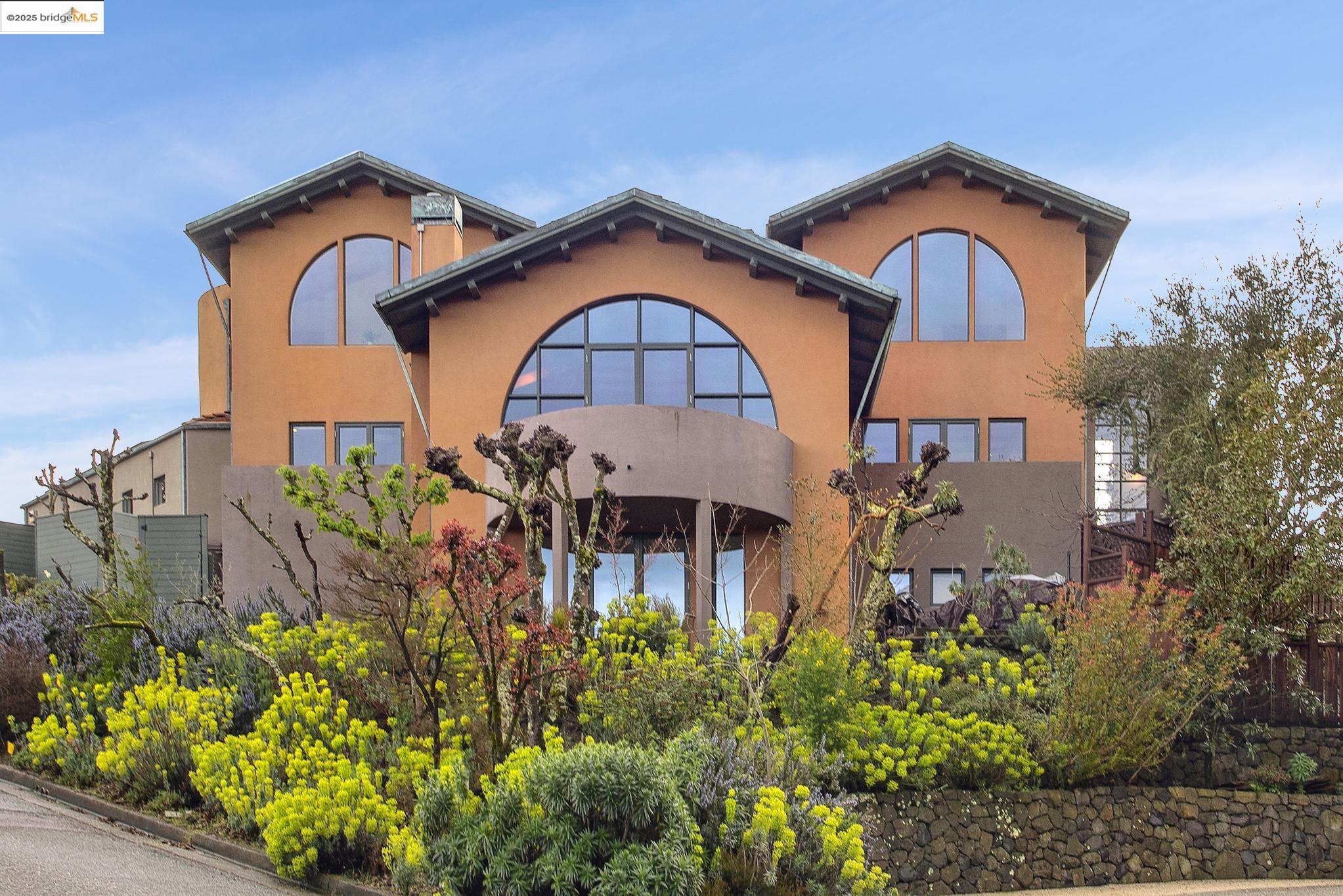5 Woodside Way Oakland, CA 94611 - Photo 2 of 59 a front view of a house with a yard and plants