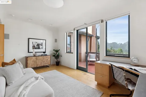 a living room with furniture and flowers