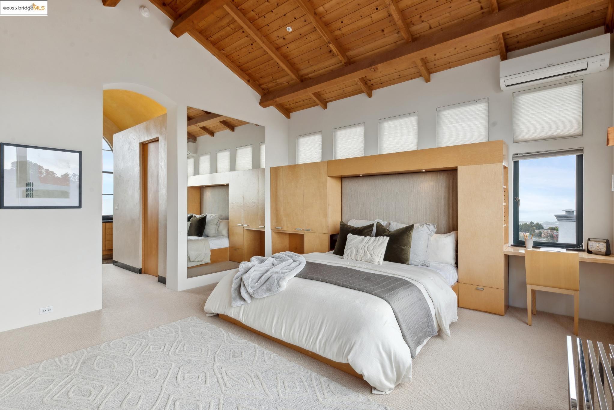 5 Woodside Way Oakland, CA 94611 - Photo 34 of 59 a bedroom with a bed and a large window