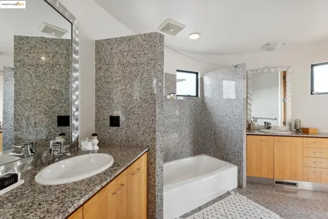 a view of a livingroom with furniture and staircase