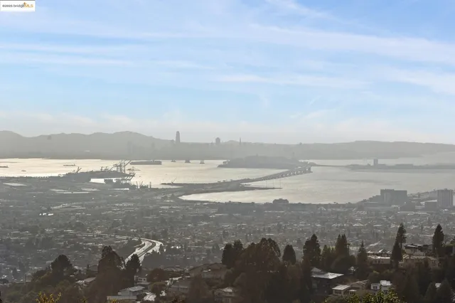 a spacious bedroom with a bed and glass door