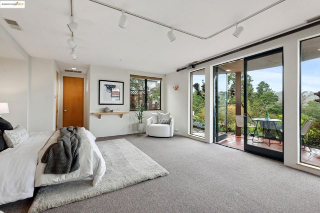 a living room with patio furniture and a yard