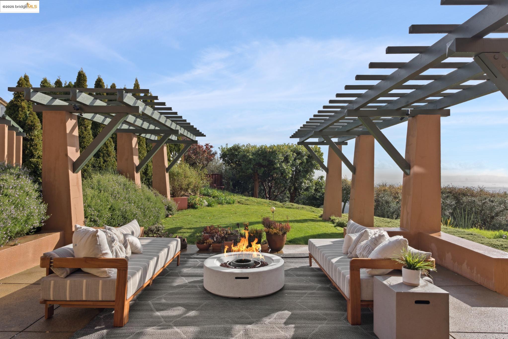 5 Woodside Way Oakland, CA 94611 - Photo 52 of 59 a patio with a table and chairs and a potted plant