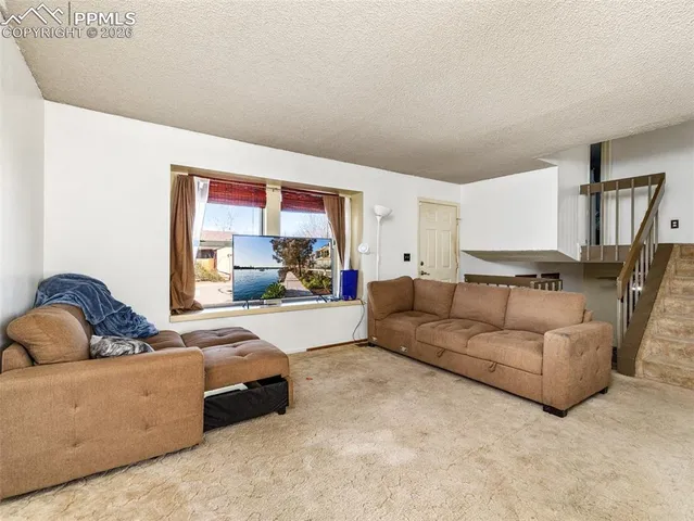 a living room with furniture and a couch