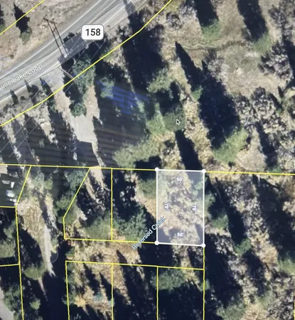 an aerial view of house with yard