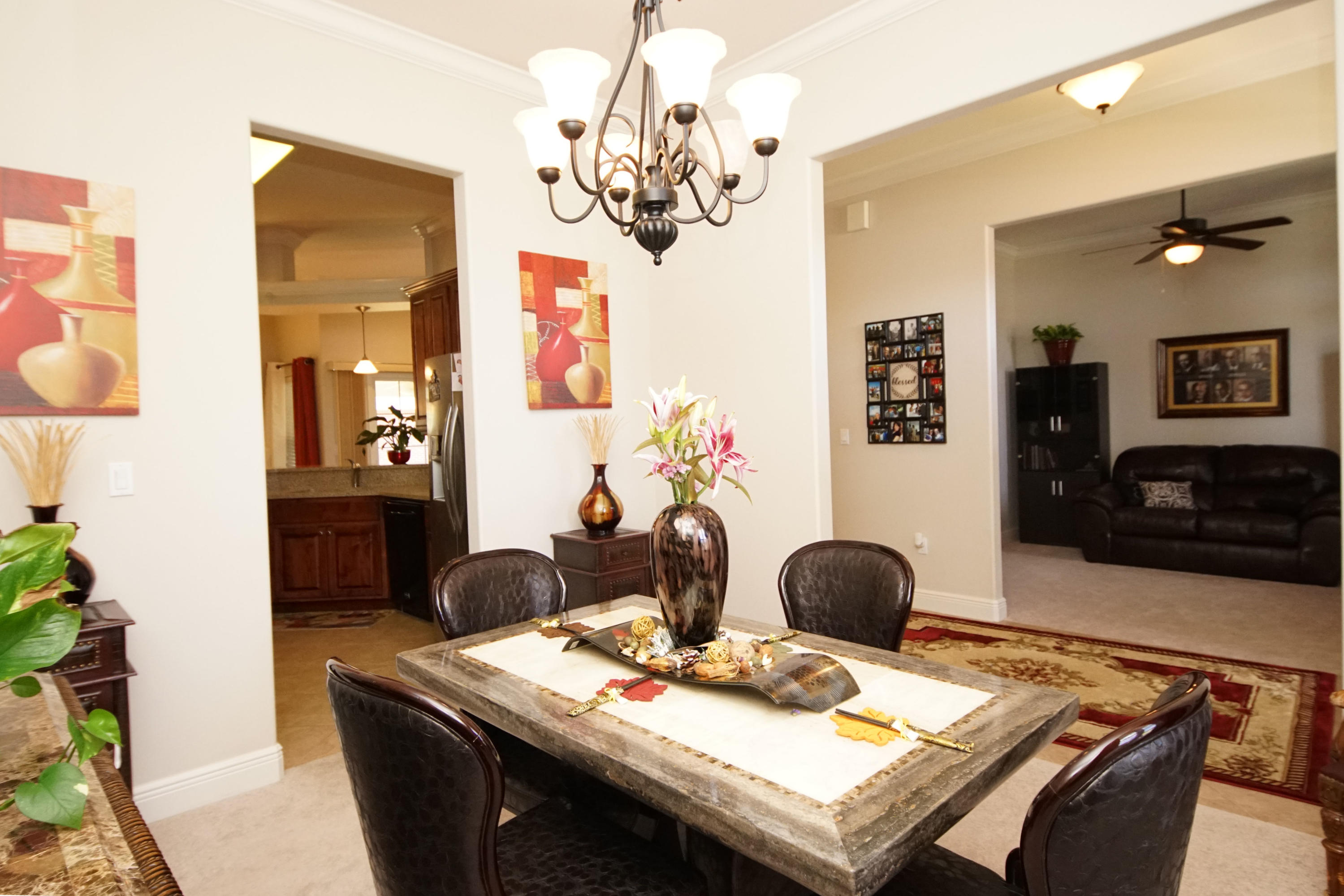 4613 Chanan Drive Crestview, FL 32539 - Photo 12 of 44 a living room with furniture and a chandelier