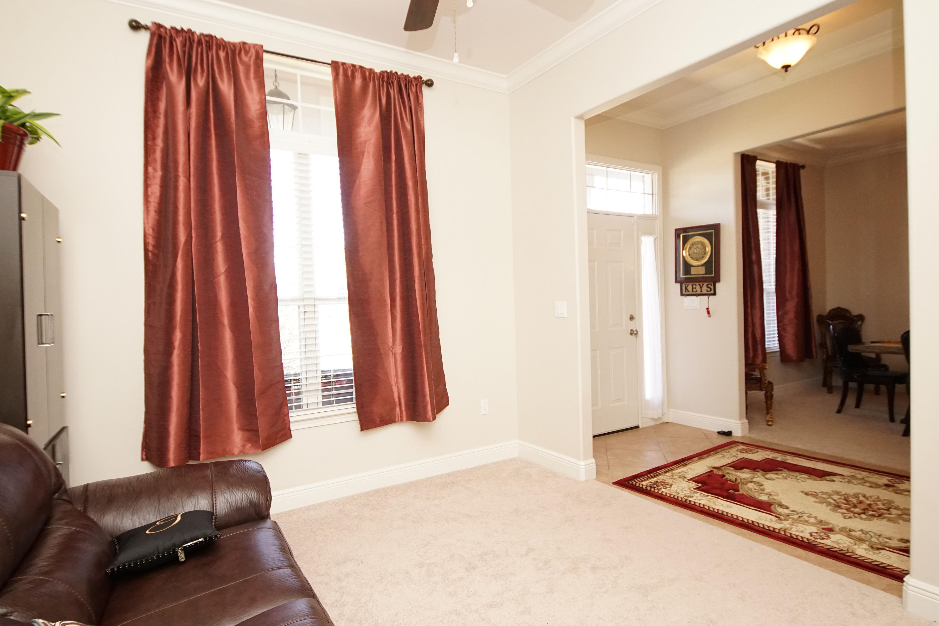4613 Chanan Drive Crestview, FL 32539 - Photo 14 of 44 a living room with furniture and a window