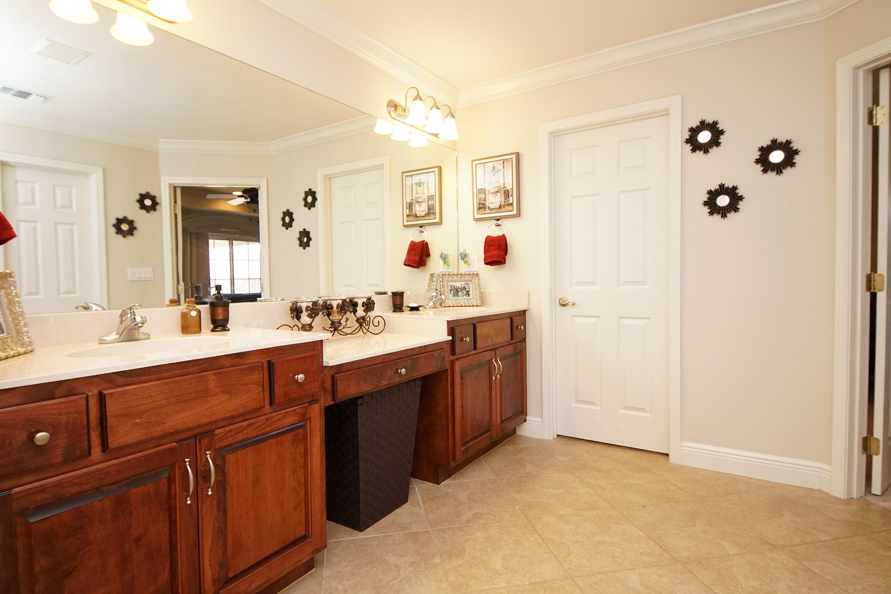 4613 Chanan Drive Crestview, FL 32539 - Photo 16 of 44 a spacious bathroom with a double vanity sink mirror and