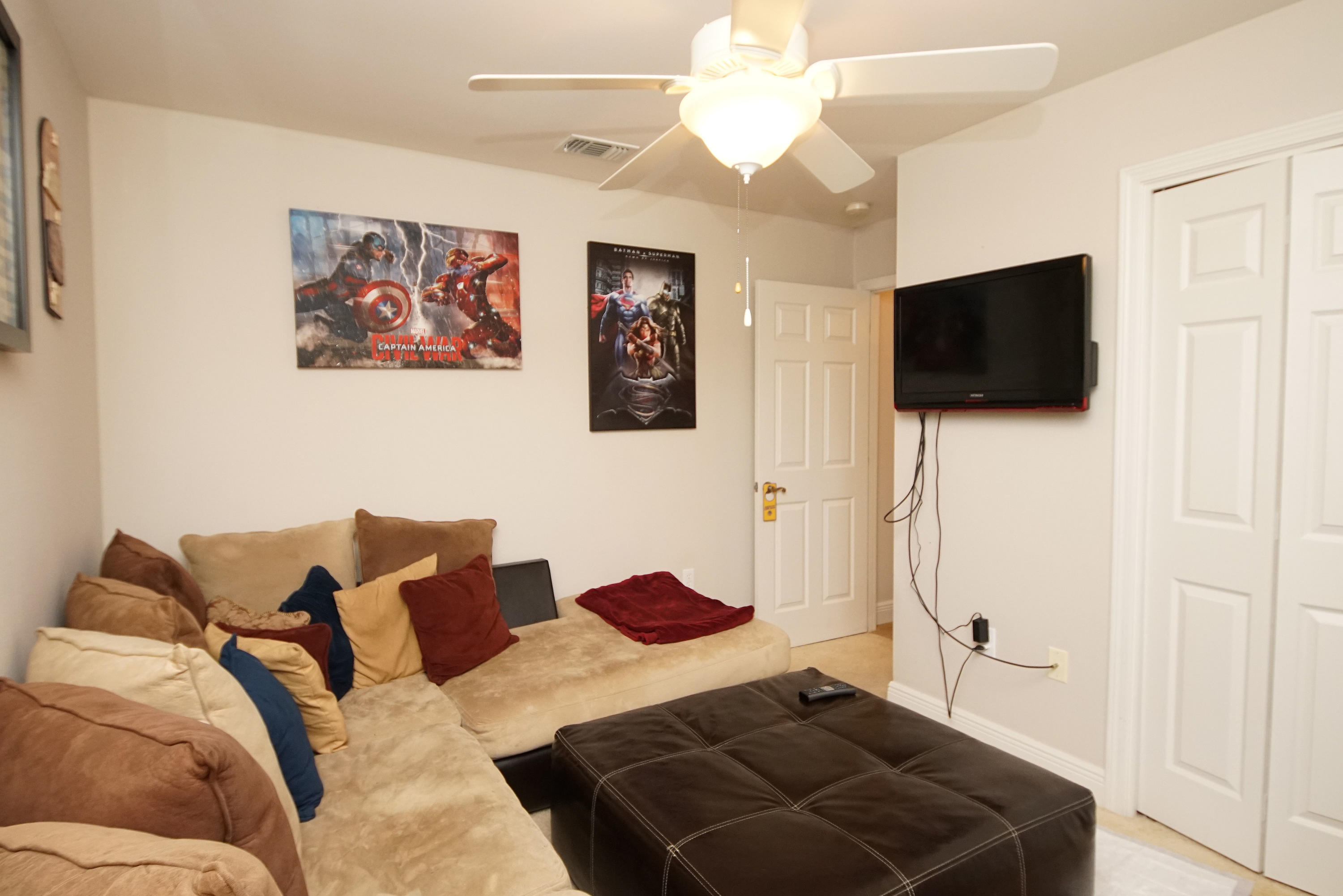 4613 Chanan Drive Crestview, FL 32539 - Photo 19 of 44 a living room with furniture and a flat screen tv