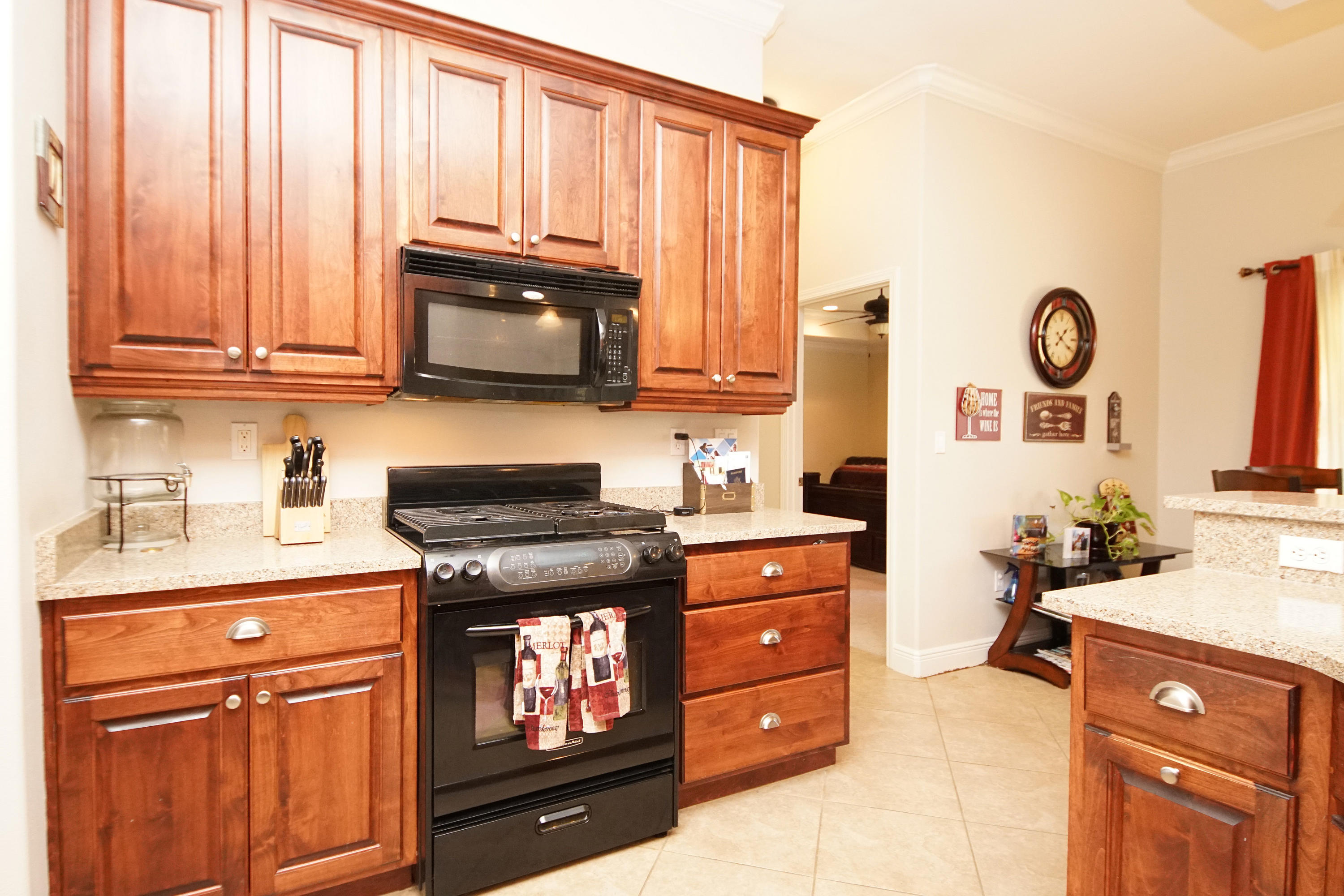 4613 Chanan Drive Crestview, FL 32539 - Photo 32 of 44 a kitchen with stainless steel appliances granite countertop a stove a sink and a microwave