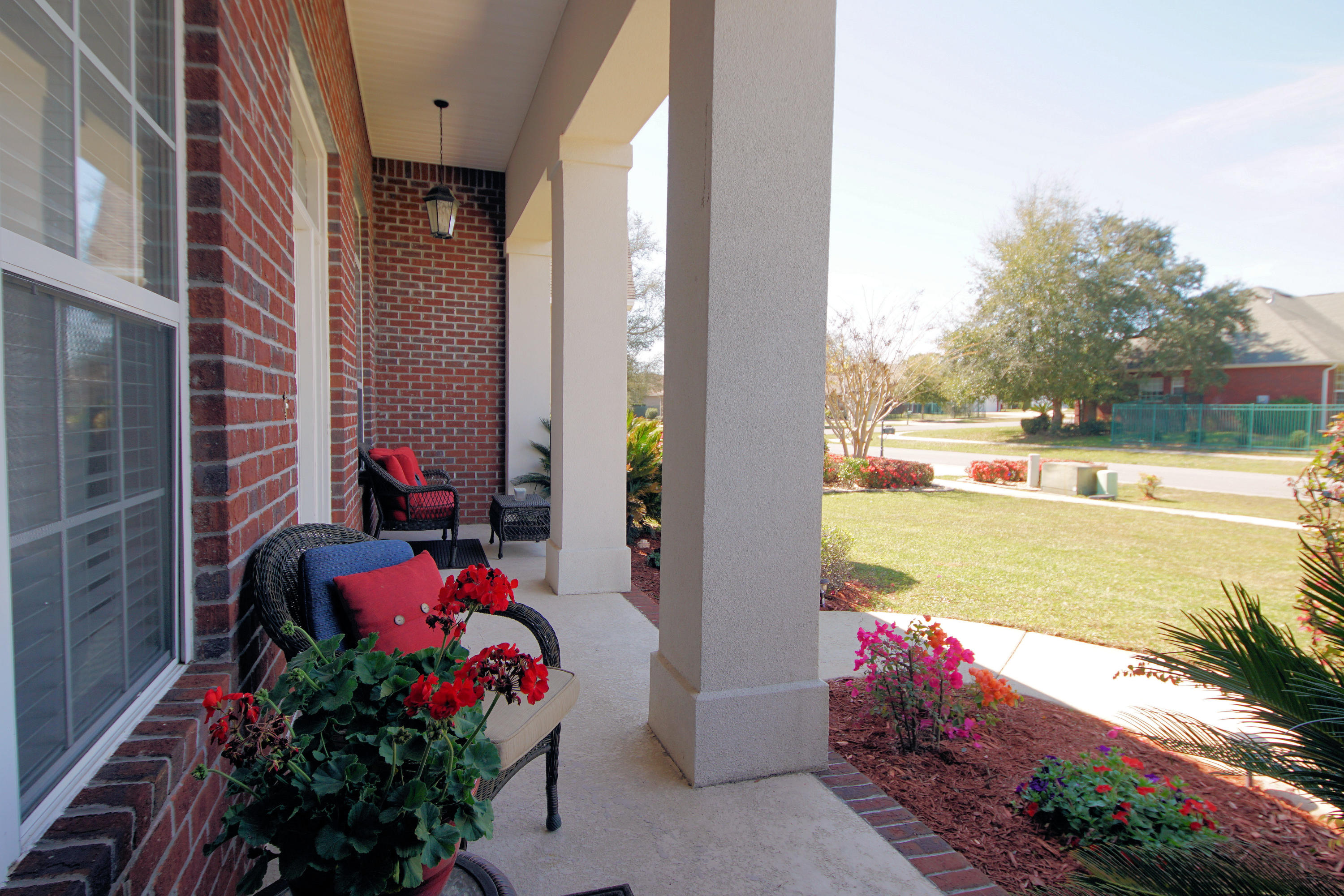 4613 Chanan Drive Crestview, FL 32539 - Photo 37 of 44 a view of a balcony with lake view and a potted plants